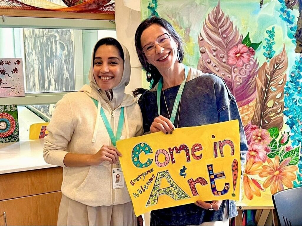 Healing Arts volunteer Fatema and Artist in Residence Marlessa Wesolowski.