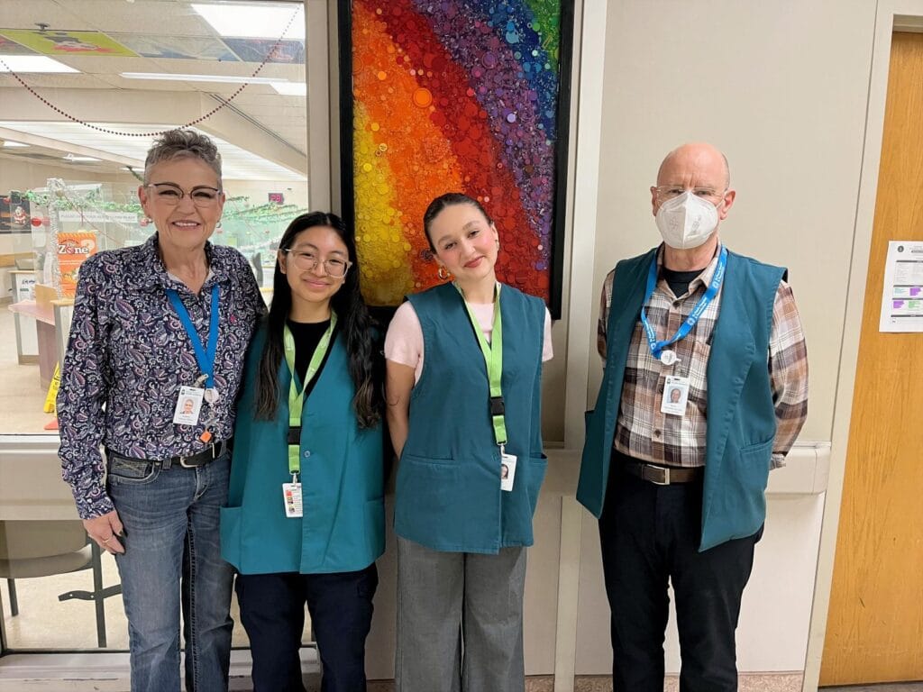 Front Entrance Hospitality Volunteers. (l-r Bonnie Marwood, Front Entrance Lead and Staff with Mariah, Sofia and Senior Volunteer Brian.